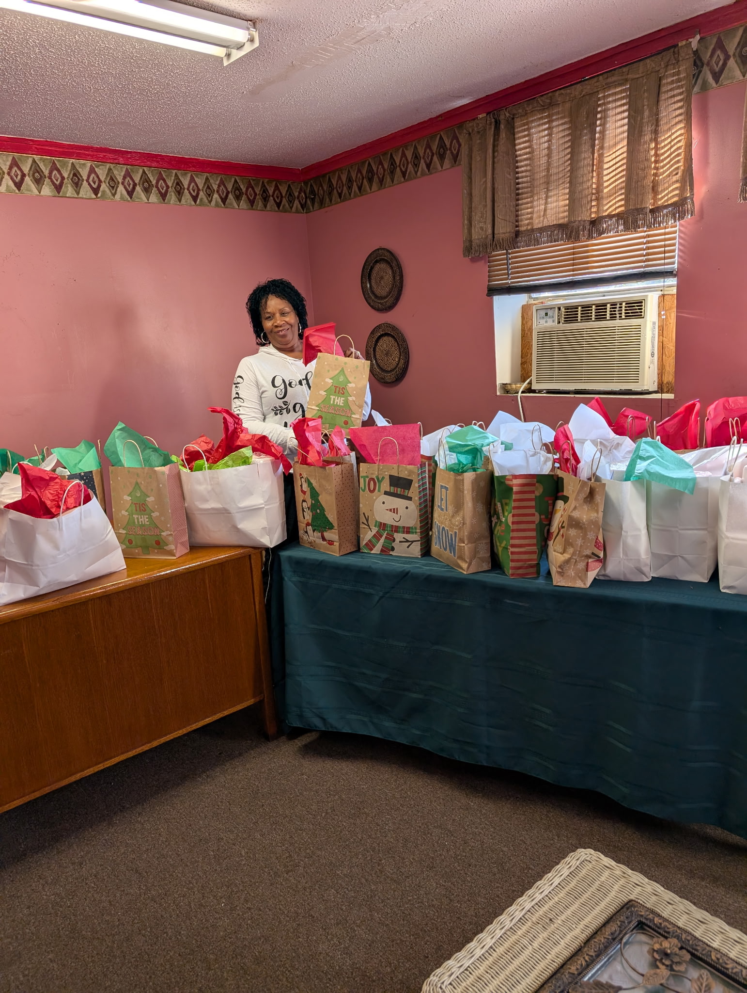 Ethel Johnson with the prepped holiday bags. Ethel Johnson with the prepped holiday bags.