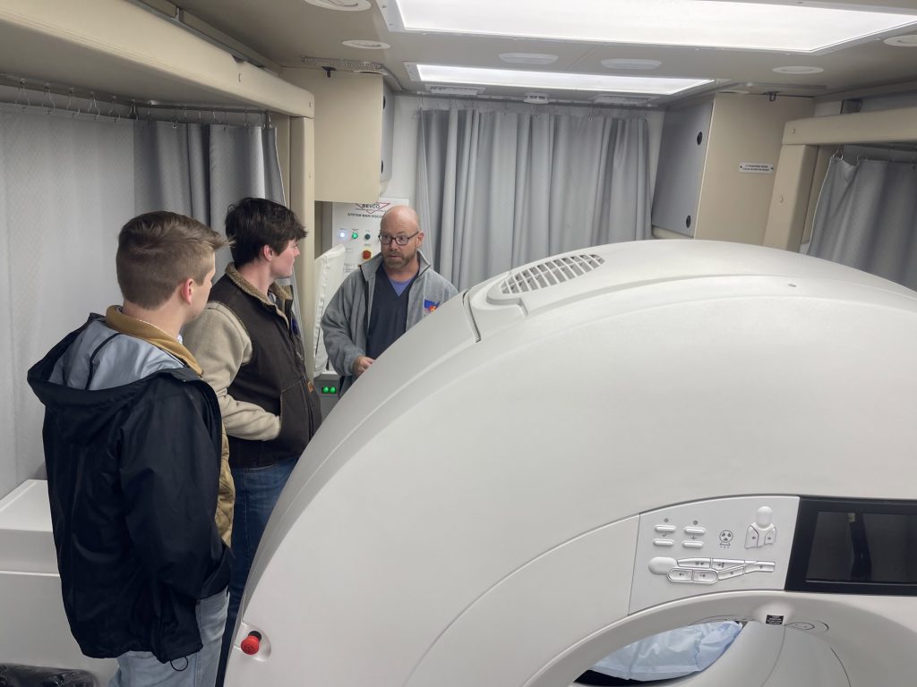 people looking at medical machine
