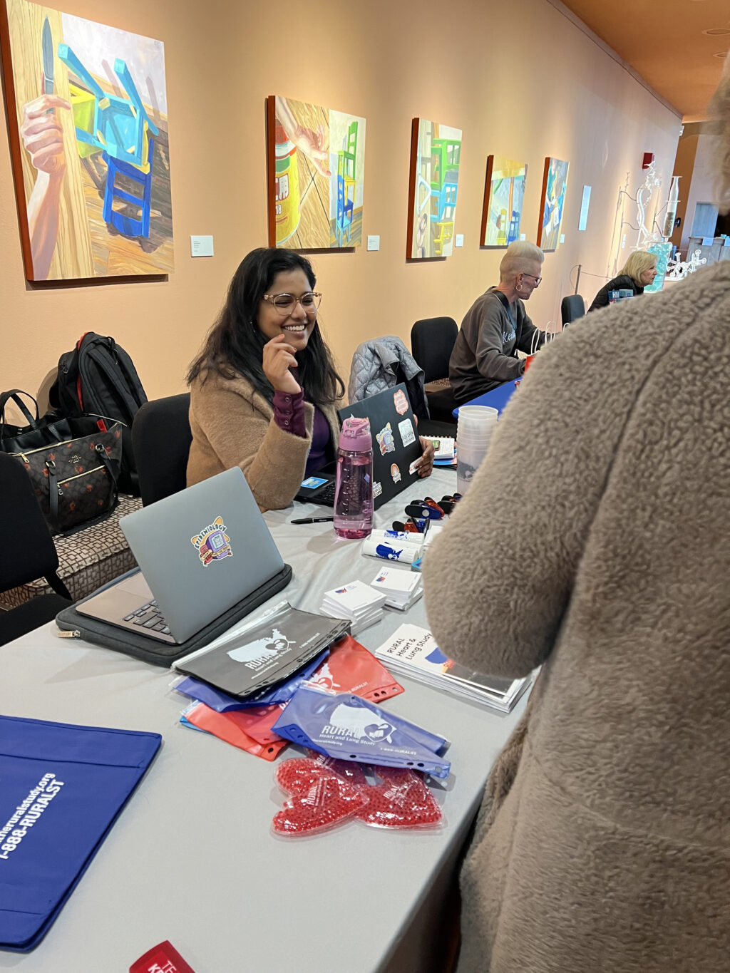 Stephie Abraham smiling sitting at table