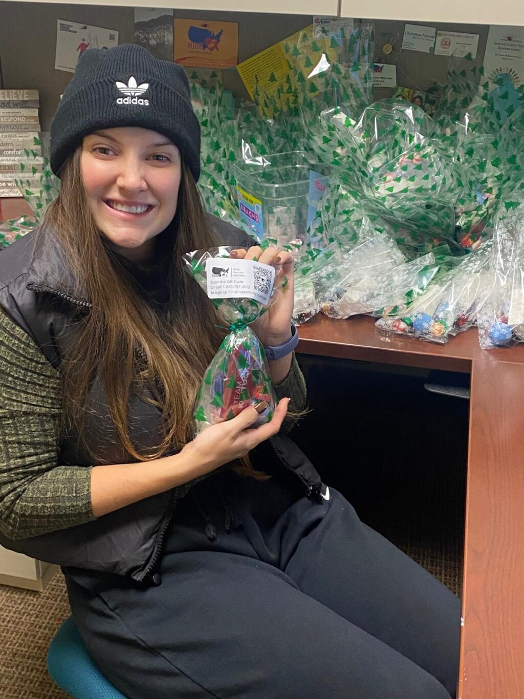 Scotland Stewart holding gift bag smiling