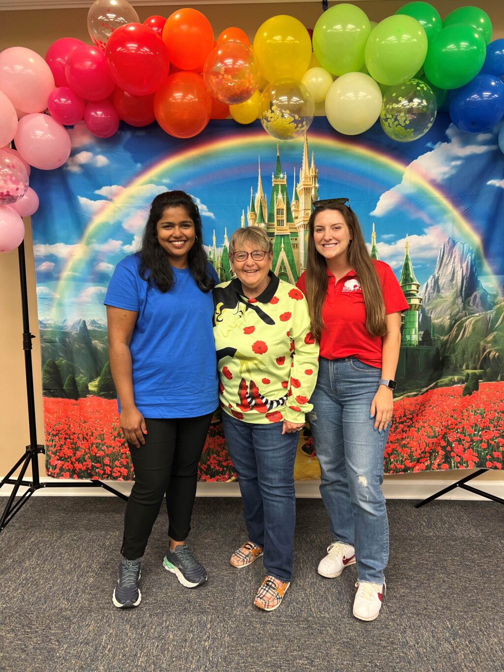 three women smiling at homakers meeting