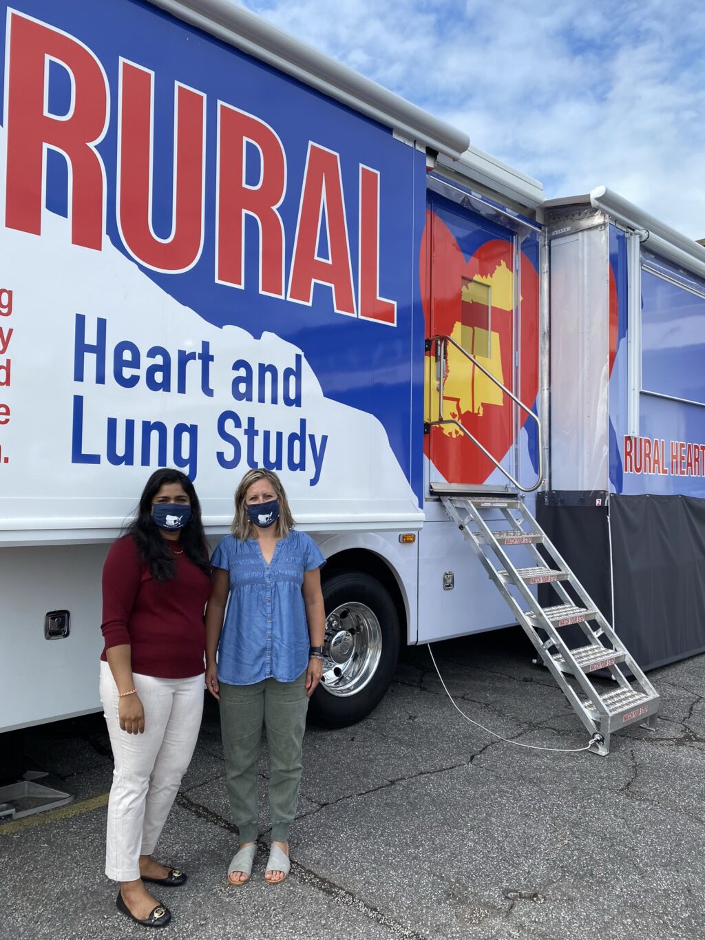 Stephie and Dr. Boone standing in front of RURAL truck