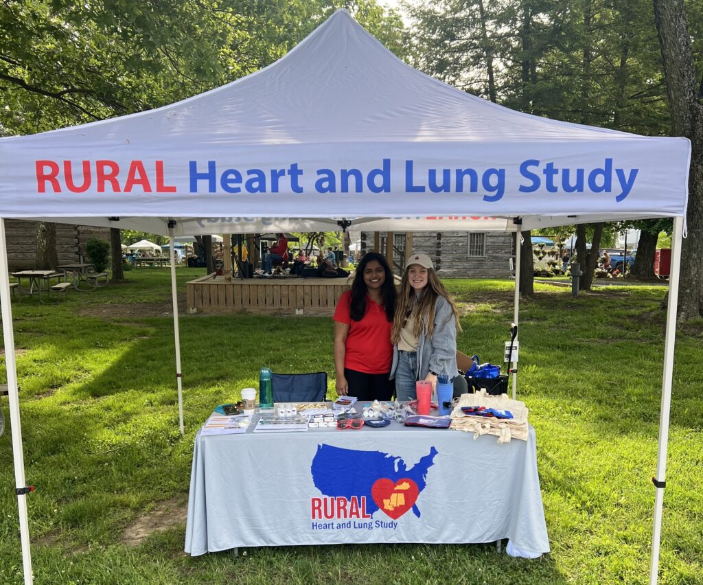Stephie Abraham and Scotland Stewart smiling at RURAL event table