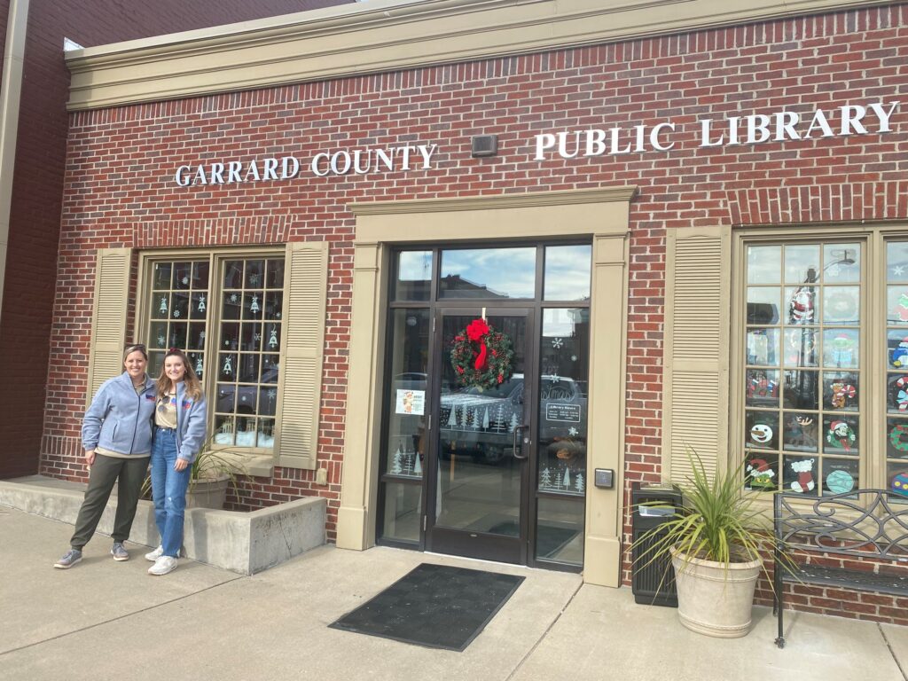 Dr. Boone and Scotland Stewart standing in front of Garrard County Public Library