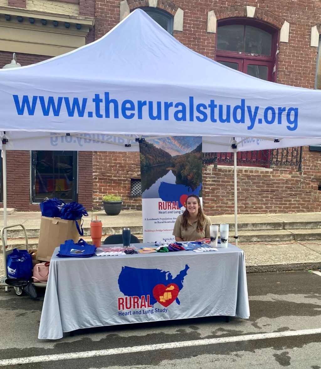 Scotland Stewart sitting smiling at RURAL event table