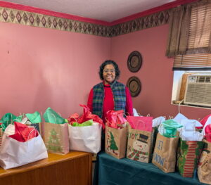Dr. Shelicia Morton-Ford with the prepped holiday bags.Dr. Shelicia Morton-Ford with the prepped holiday bags.